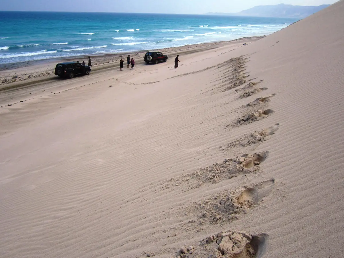 Footprints across the dunes above the sea at Rosh